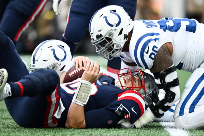 Nov 6, 2022; Foxborough, Massachusetts, USA; Indianapolis Colts defensive tackle DeForest Buckner (99) and defensive tackle Eric Johnson (93) sack New England Patriots quarterback Mac Jones (10) during the first half at Gillette Stadium.
